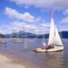 Yacht On Loch Lomond Near The Shore At Luss With Ben Lomond In View