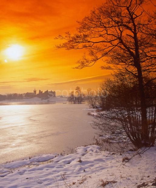 Winter Sunset Across Linlithgow Loch Towards Linlithgow Palace Linlithgow West Lothian Scotland