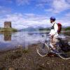 Cycling Nr Appin Argyll With Castle Stalker And Morvern Hills