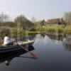 I5D1208 Rowing Boat And Thatched Cottages Argyll