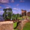 Summer Scene Amidst The Ruins Of Urquhart Castle Loch Ness Scottish Highlands