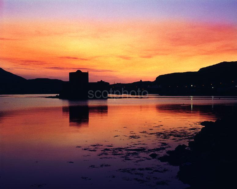 Dramatic Sunset Afterglow Over Castlebay And Kisimul Castle Barra