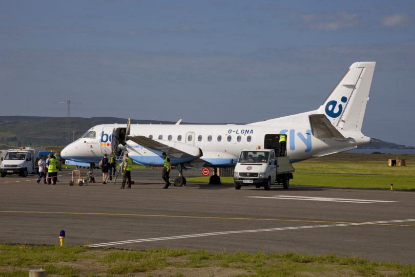 SAAB 340 EMBARKS PASSENGERS AT ISLAY AIRPORT