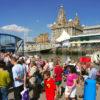 Tourist Await The Ferry At The Pier Head