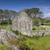 Tourists Visit Kildalton Chapel And Cross Islay