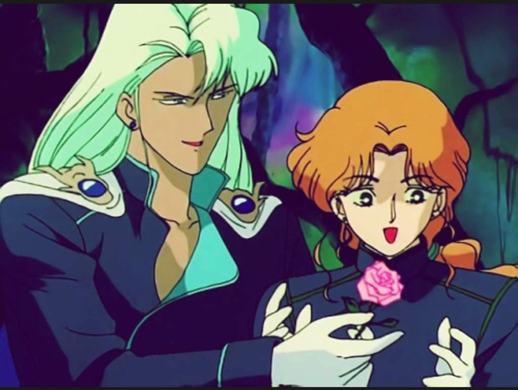Malachite leaning over and hands a happy Zoisite a pink rose.