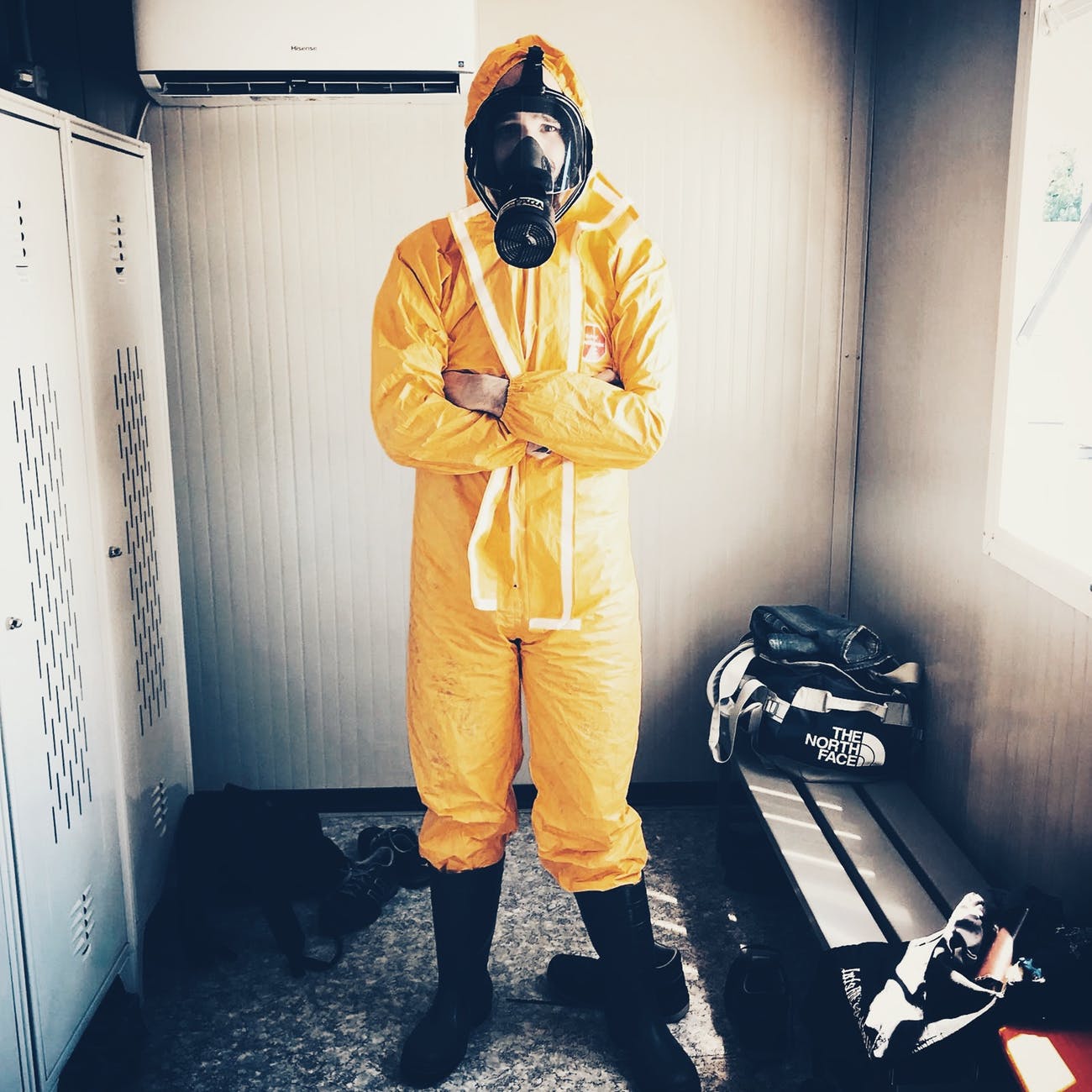 man wearing haphazard suit to avoid zombie infection
