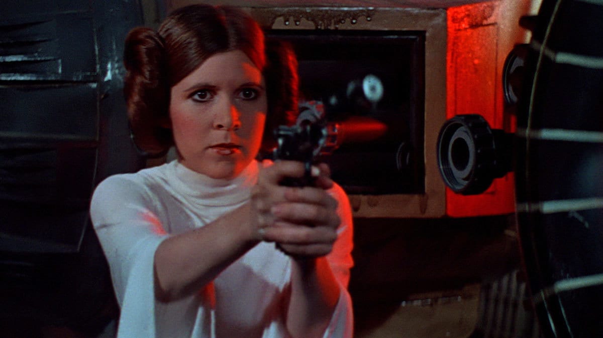 Princess Leia surrounded by Stormtroopers.