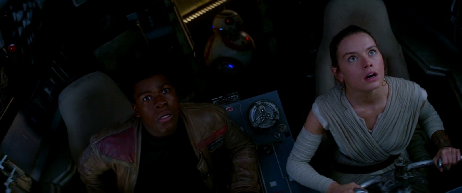 Finn and Rey aboard the Millennium Falcon