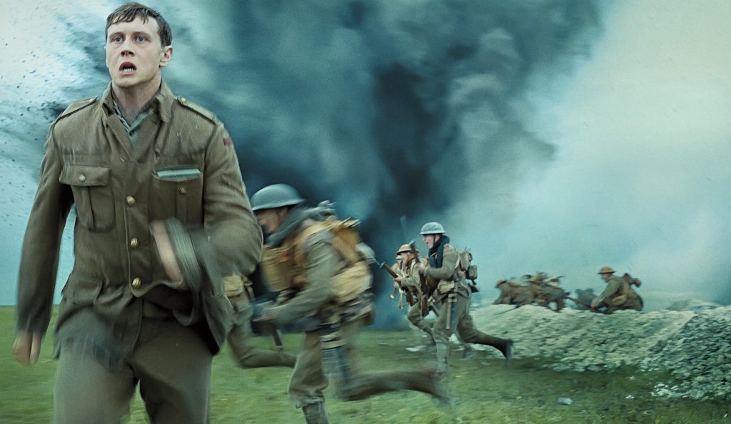 George MacKay runs during a battle in 1917, a film overlooked by the Oscars for editing.