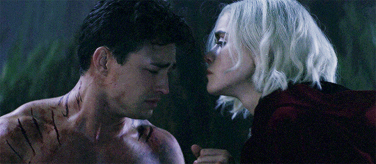 Sabrina giving Nick a tender forehead kiss.