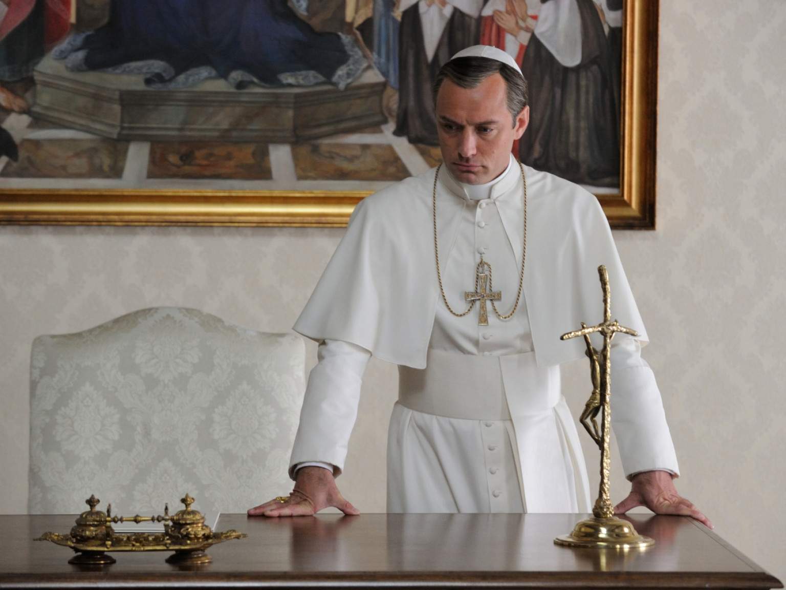 The young pope contemplating his faith on god.