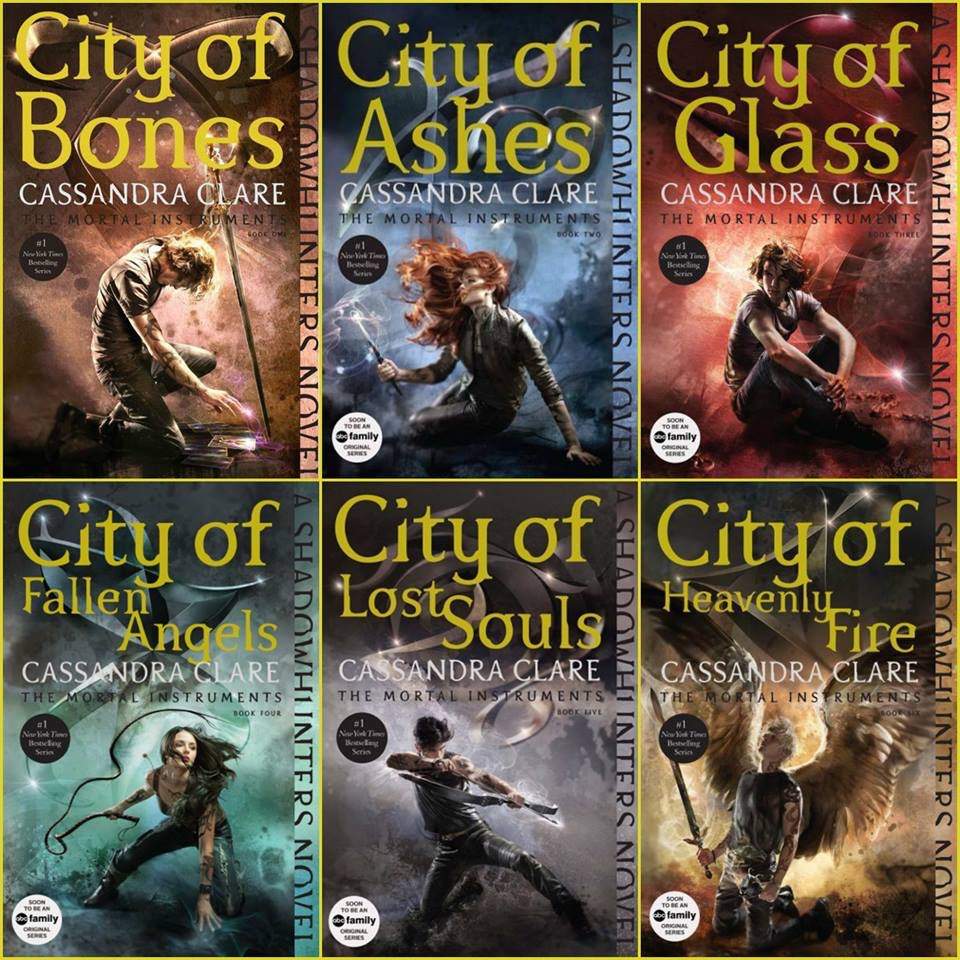 The six stylized covers of the YA novel series The Mortal Instruments. Each has the title along with a main character surrounded by varying colors of light.