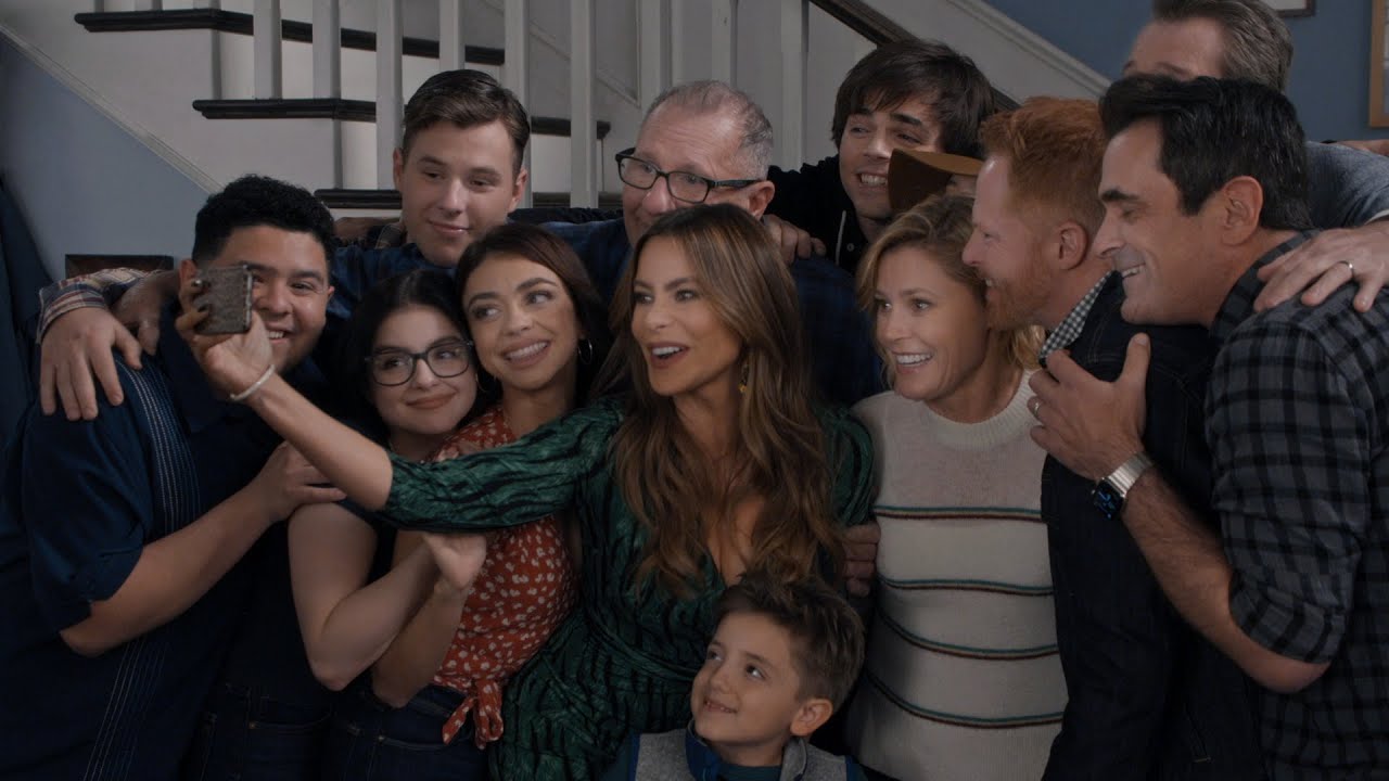 The entire family taking a selfie one last time.