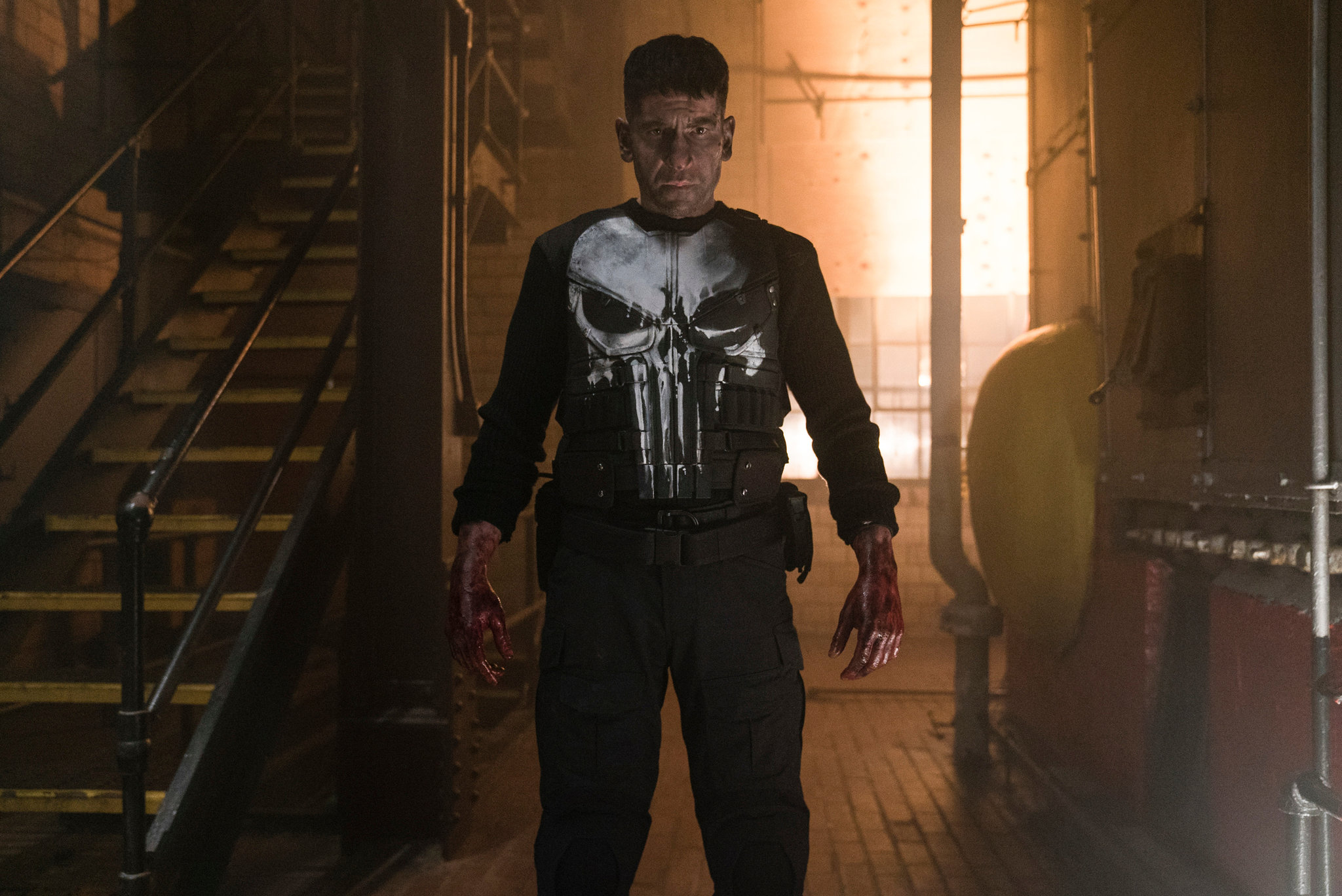 Frank Castle stares at the camera with bloodied hands.