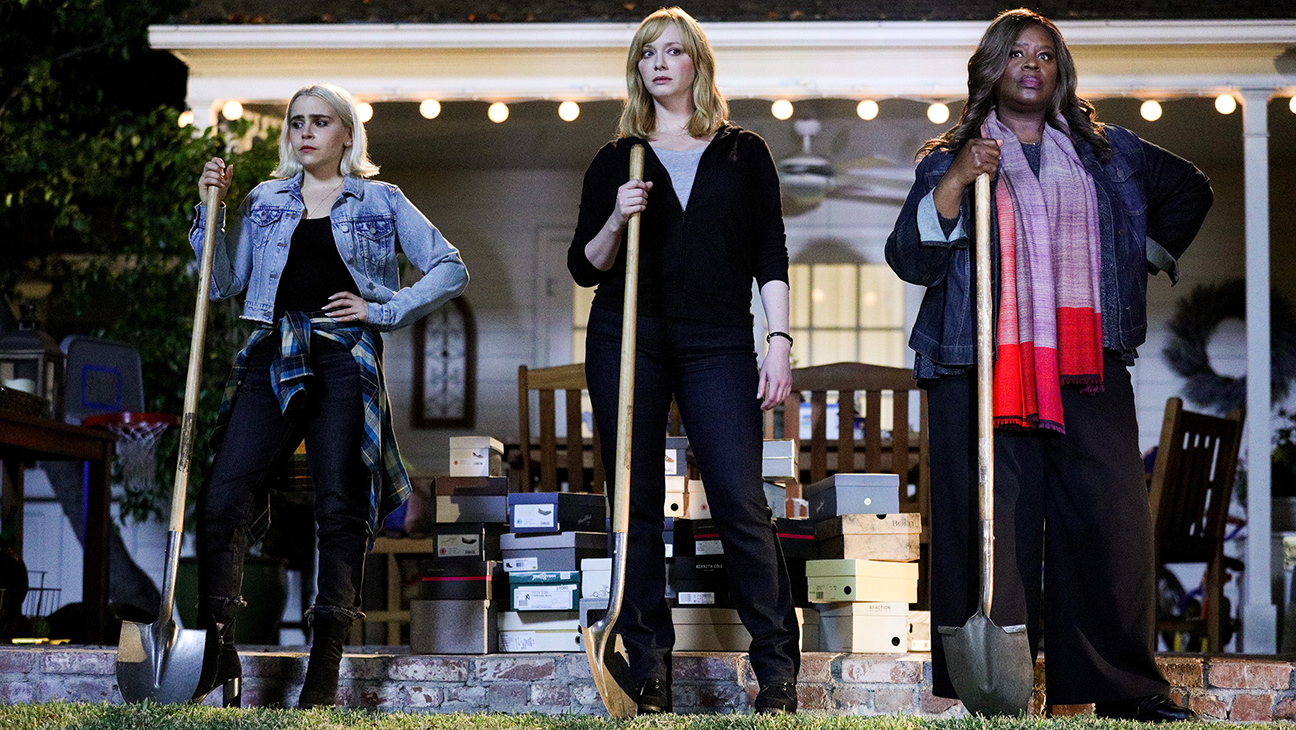 Annie, Beth, and Ruby hold shovels, ready to bury the shoeboxes behind them in Good Girls.