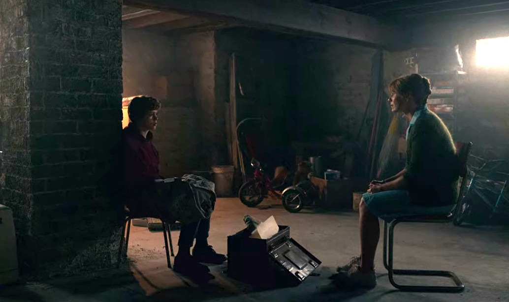 Sydney and her mother talk in their basement.