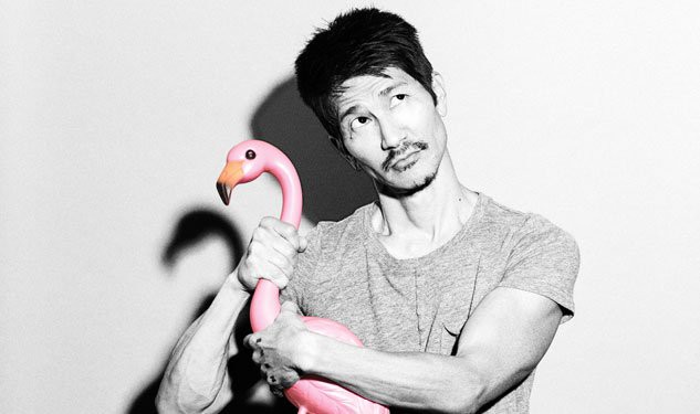 Gregg Araki holding a garden flamingo