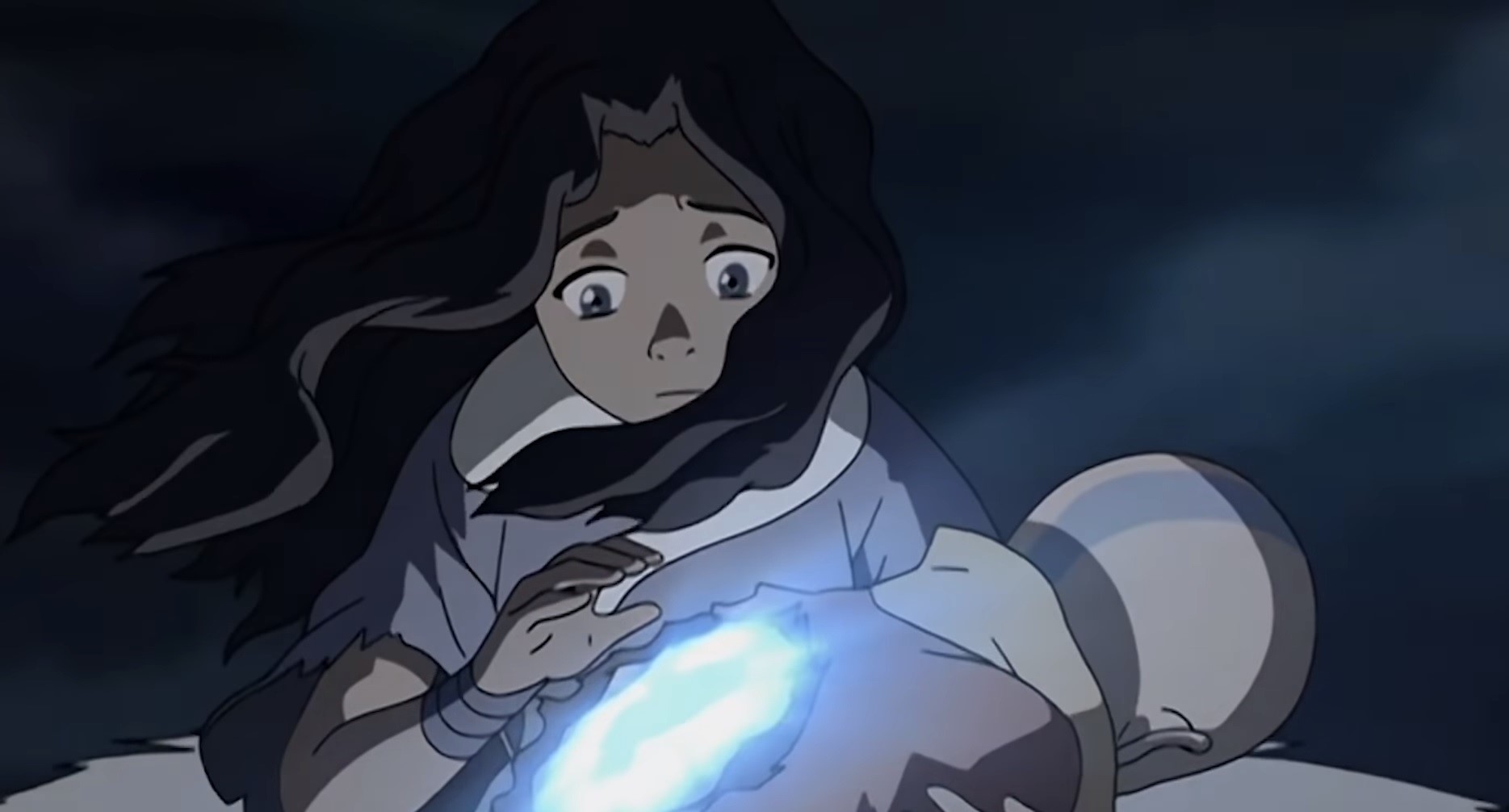 Katara using her healing ability to help Aang 