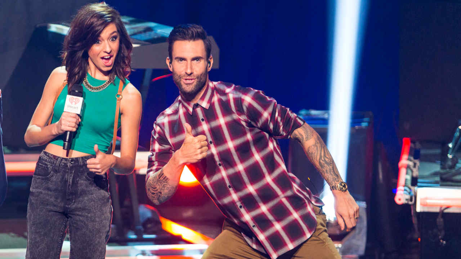 Christina Grimmie and Adam Levine pose together on the set of The Voice.