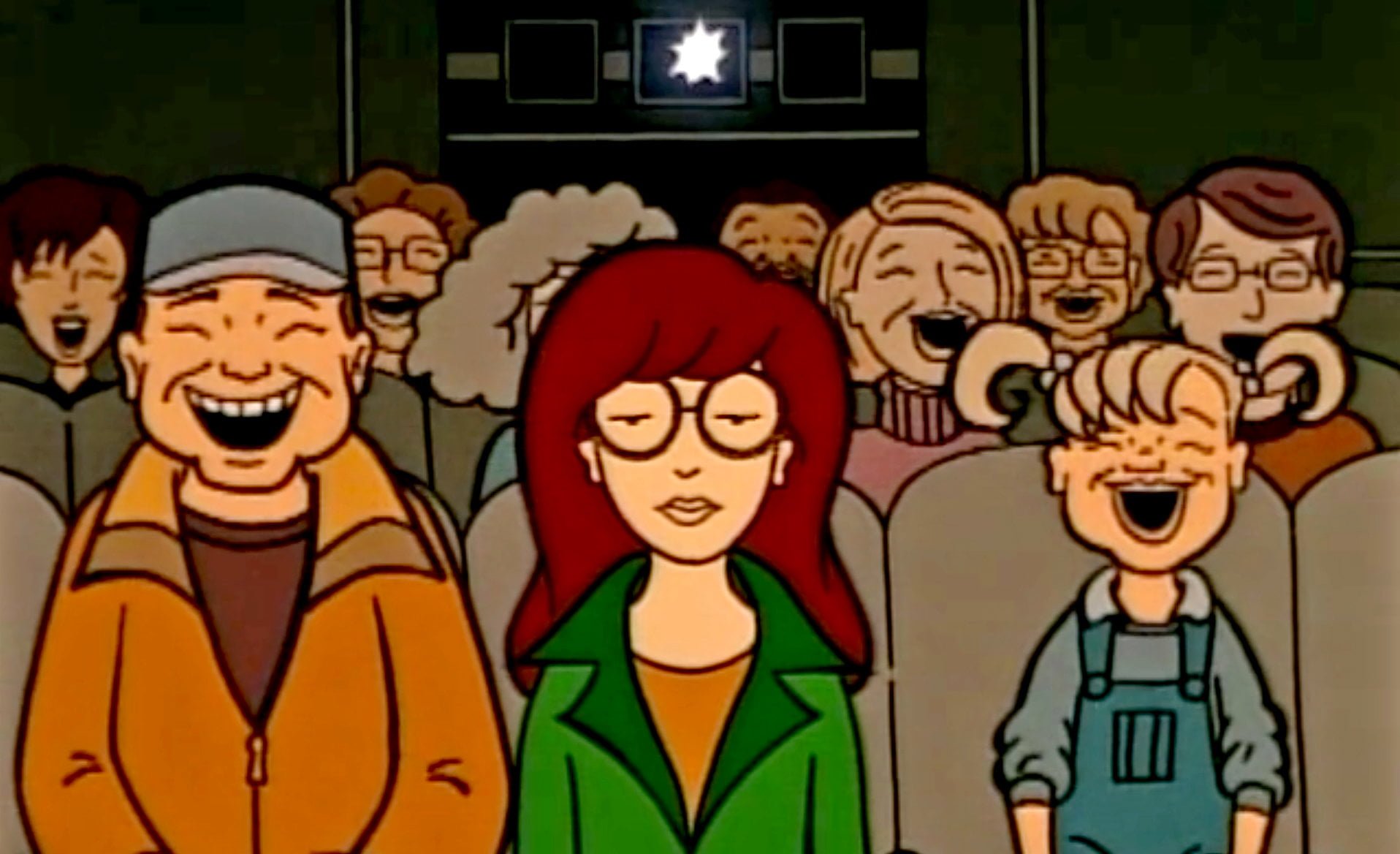 Daria Morgendorffer sits in a packed movie theater, unamused, while everyone else laughs. 