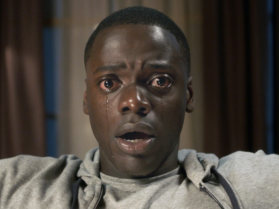 Chris from the horror movie, Get Out, with a shocked expression and tears running down his face.