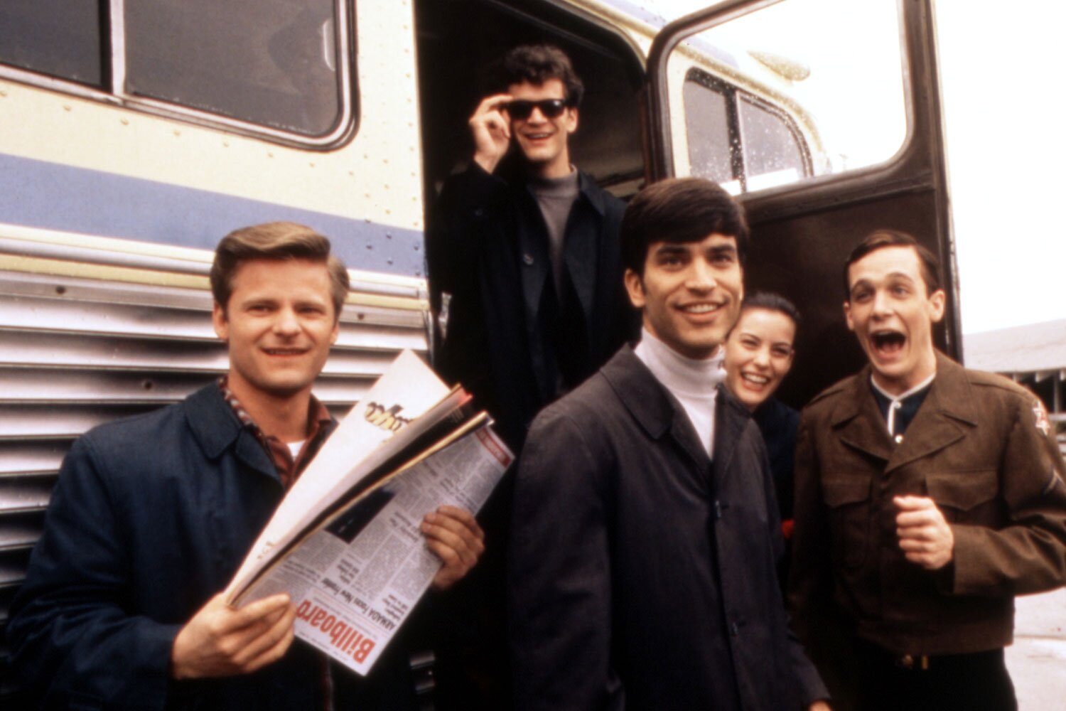 The stars of the musical "That Thing You Do!" hang out near a bus.