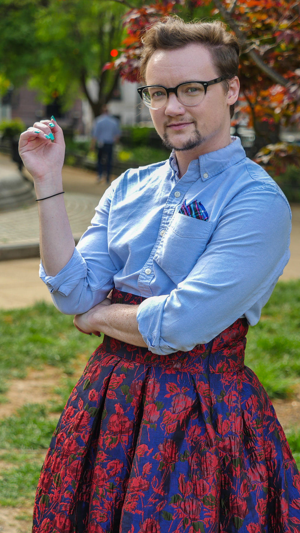 Queer fiction and transgender author KM Szpara standing outside