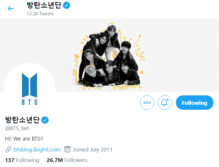 The Twitter page of K-pop group BTS featuring a black and white picture of them in the header with yellow drawings surrounding them and the BTS logo as their profile picture