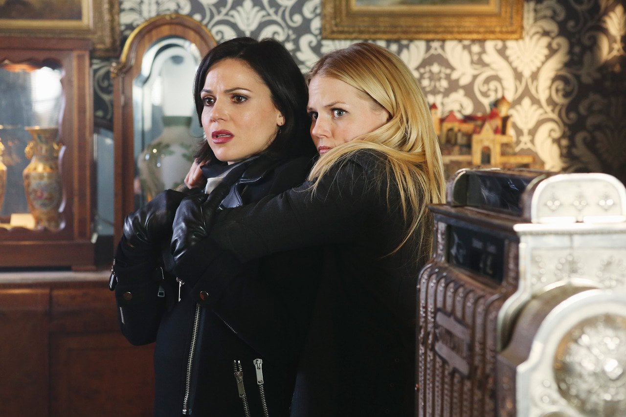 Emma Swan arms are around Regina Mills.