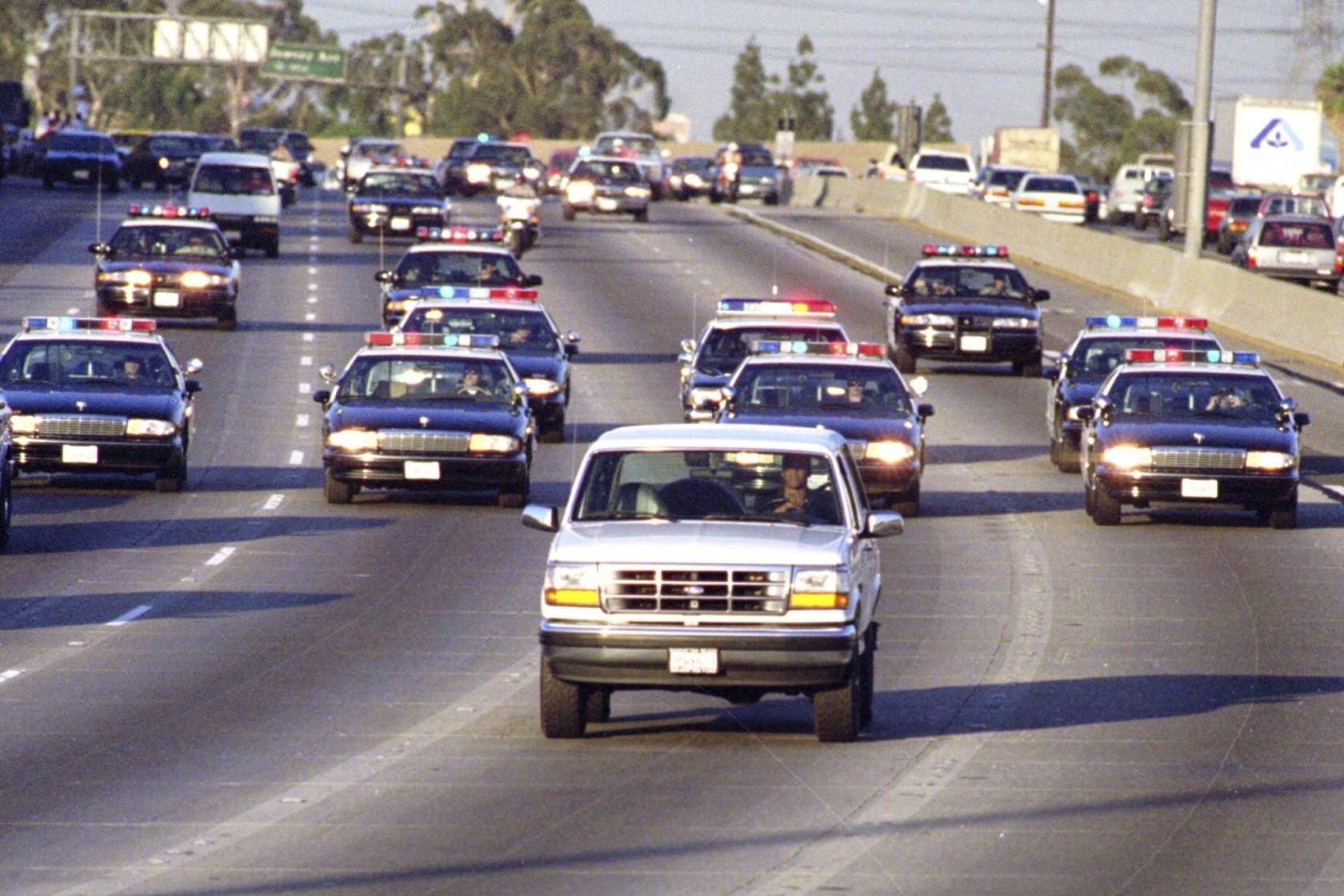 O.J. Simpson driving his Ford Bronco while being chased by police for resisting arrest. 