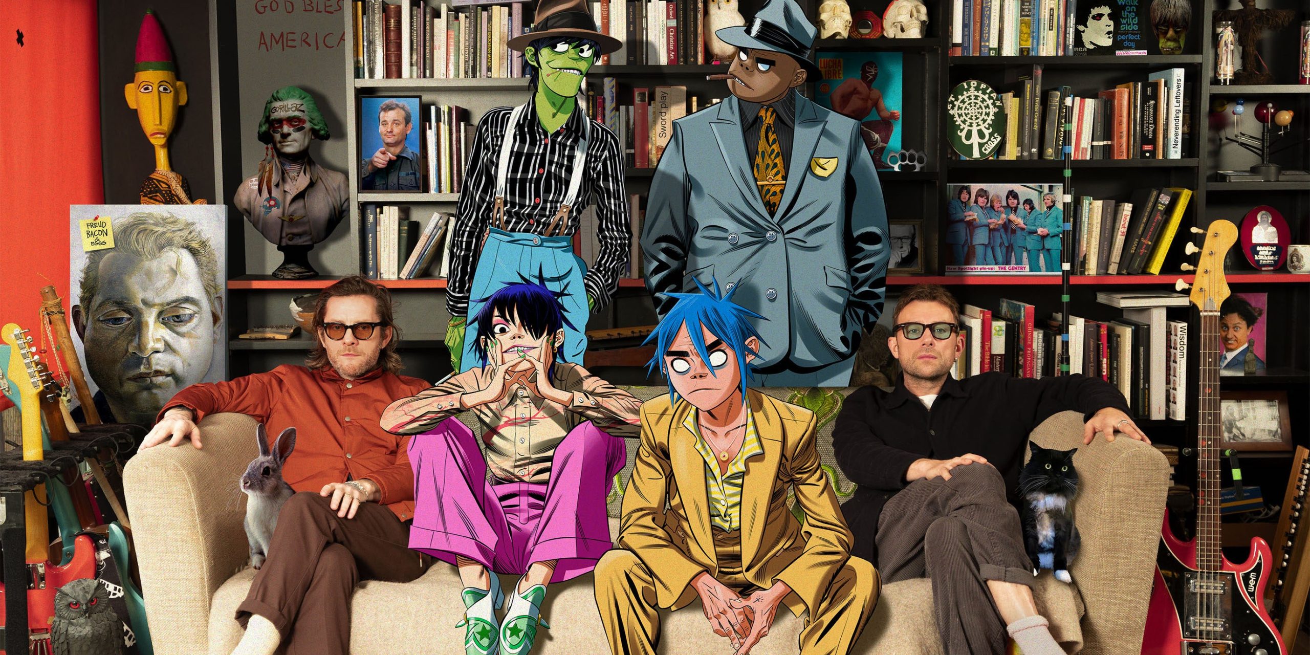 Gorillaz's virtual band members are pictured alongside their creators, Jamie Hewlett and Damon Albarn, on a tan couch. 