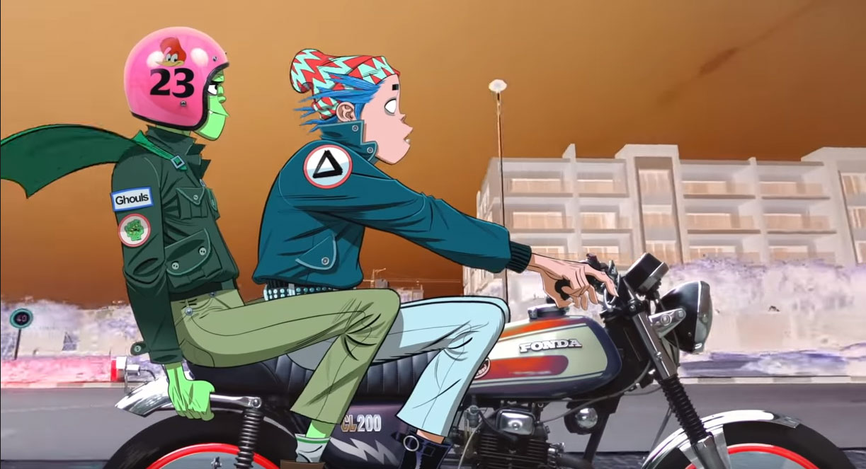 Gorillaz's lead vocalist, 2D, sit with his bandmate, Murdoc Niccals, on a motorcycle. 