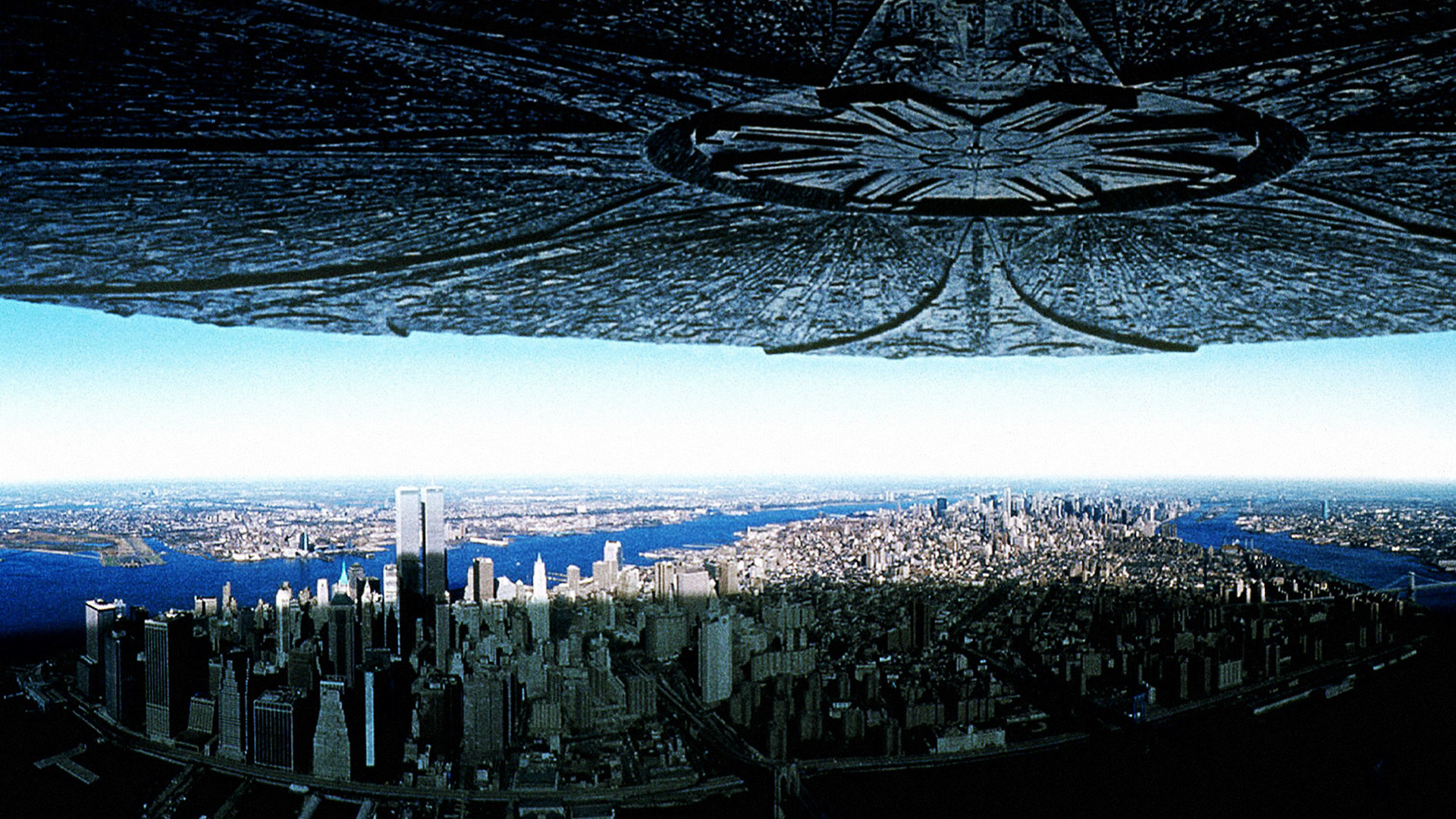 The theatrical movie poster shows an alien spaceship hovering over Manhattan, New York.