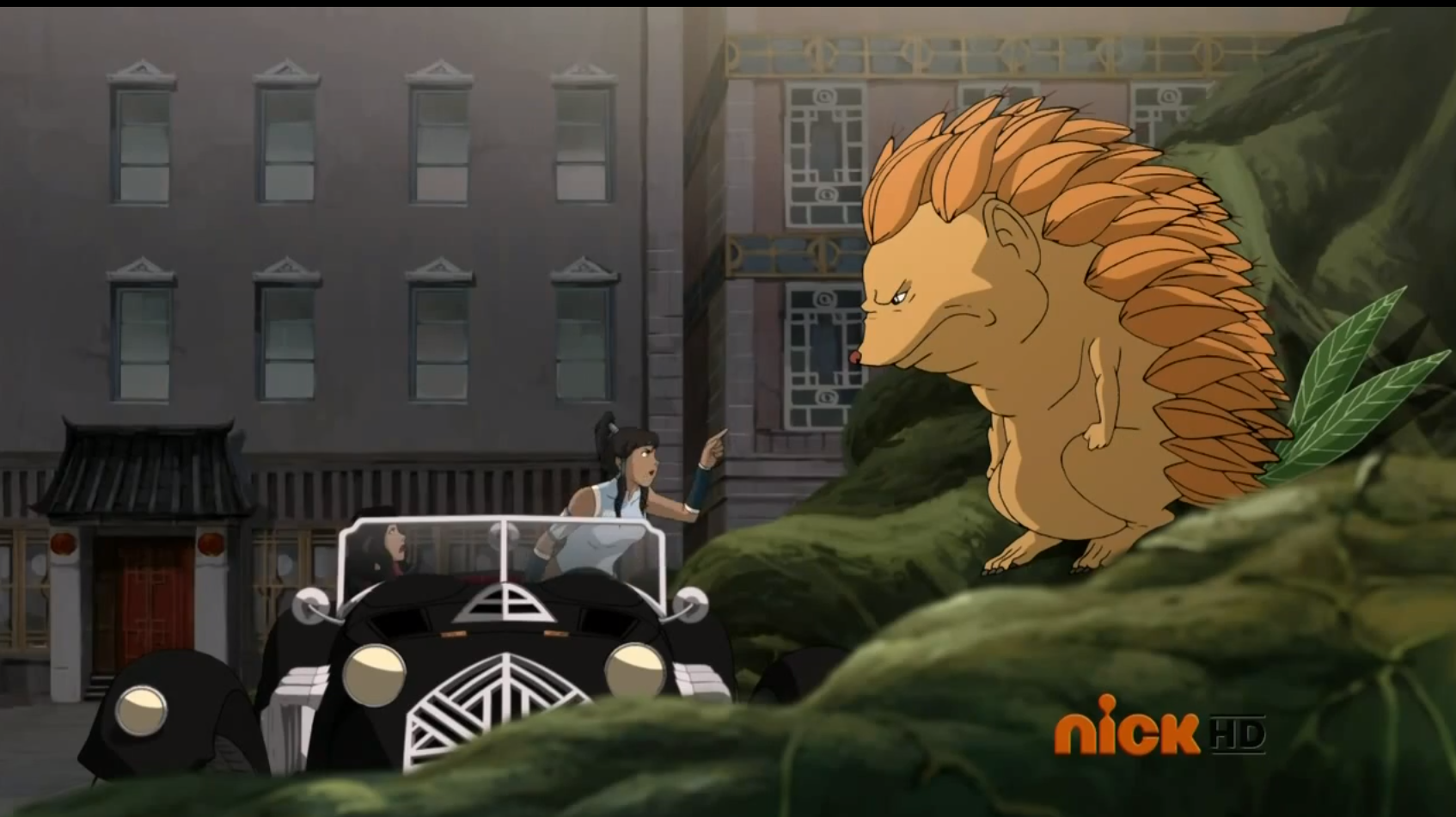 Korra arguing to a hedgehog spirit about the spirit vines blocking the road.