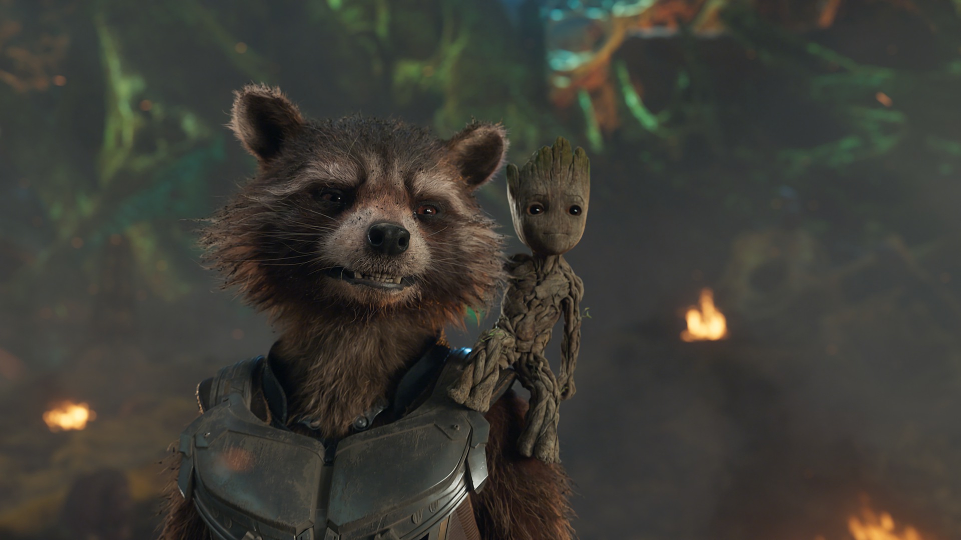 Baby Groot sits on Rocket the Raccoon's shoulder, both smiling.