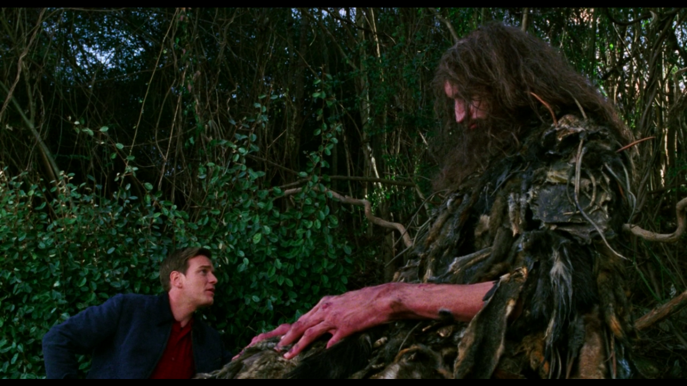 Edward Bloom from the movie Big Fish talks to Karl the Giant outside of his cave.