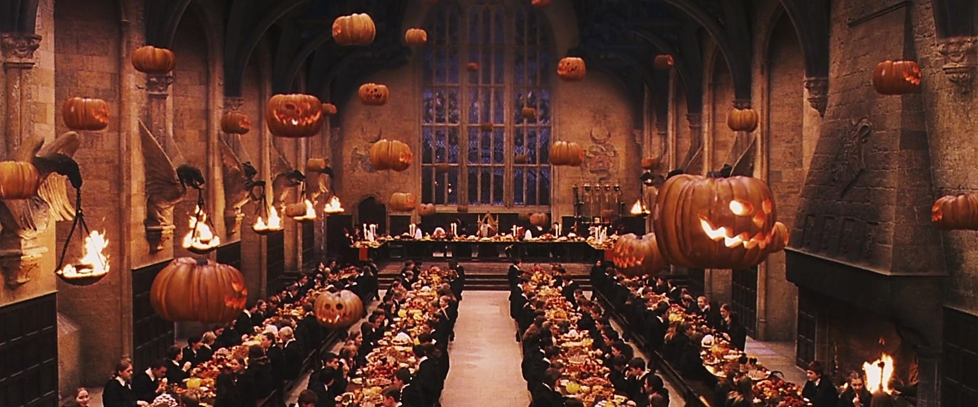 A wide-shot of the banquet hall in the movie Harry Potter shows floating jack o' lanterns above the students and staff.