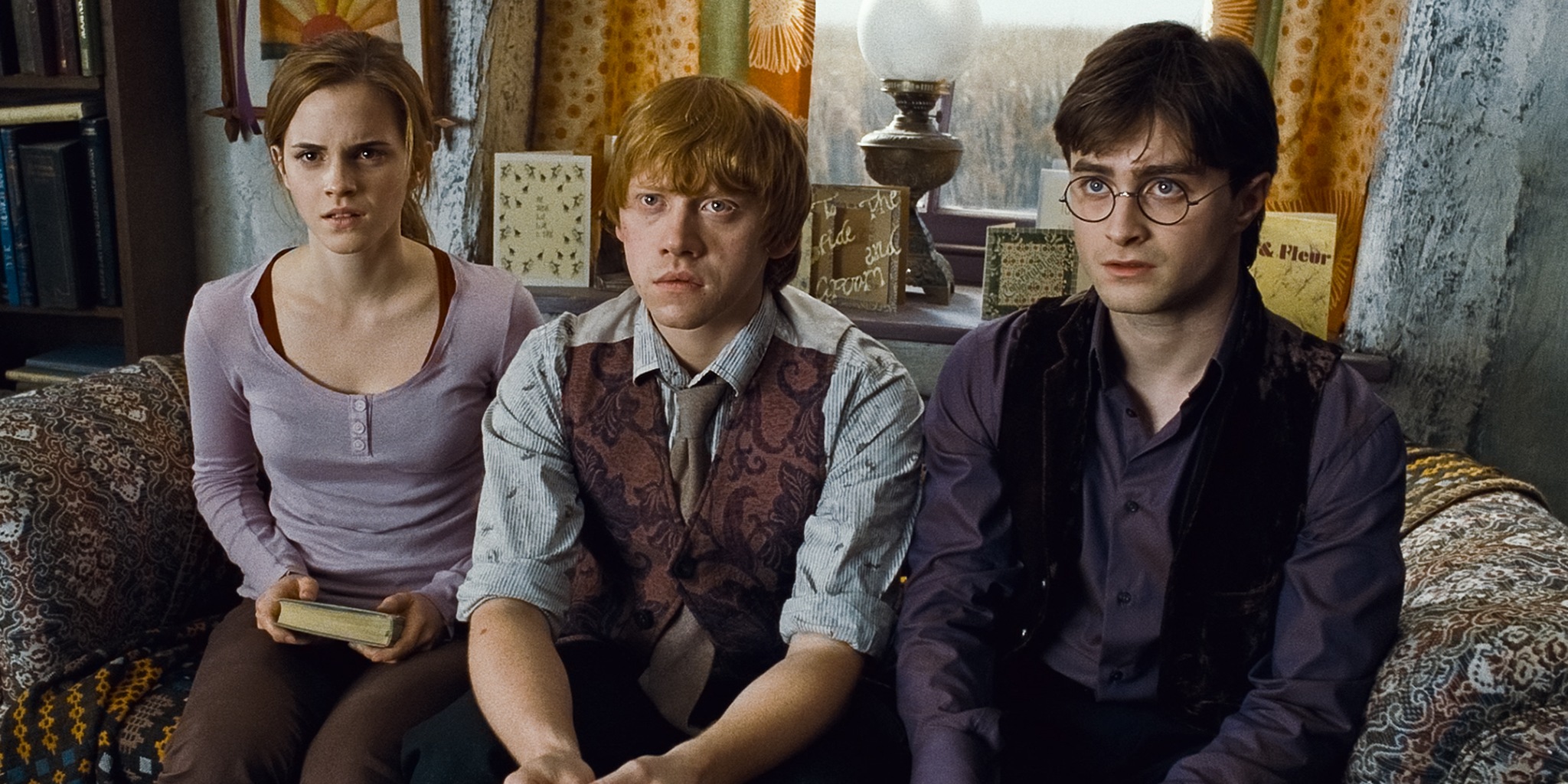 The Golden Trio sitting on a sofa.