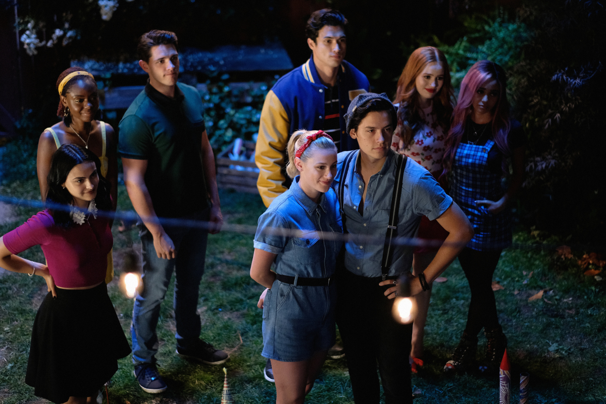 Riverdale -- "Chapter Fifty-Eight: In Memoriam" -- Image Number: RVD401b_0209.jpg -- Pictured (L-R): Camila Mendes as Veronica, Ashleigh Murray as Josie, Casey Cott as Kevin, Charles Melton as Reggie, Lili Reinhart as Betty, Cole Sprouse as Jughead, Madelaine Petsch as Cheryl and Vanessa Morgan as Toni -- Photo: Robert Falconer/The CW -- © 2019 The CW Network, LLC. All Rights Reserved.