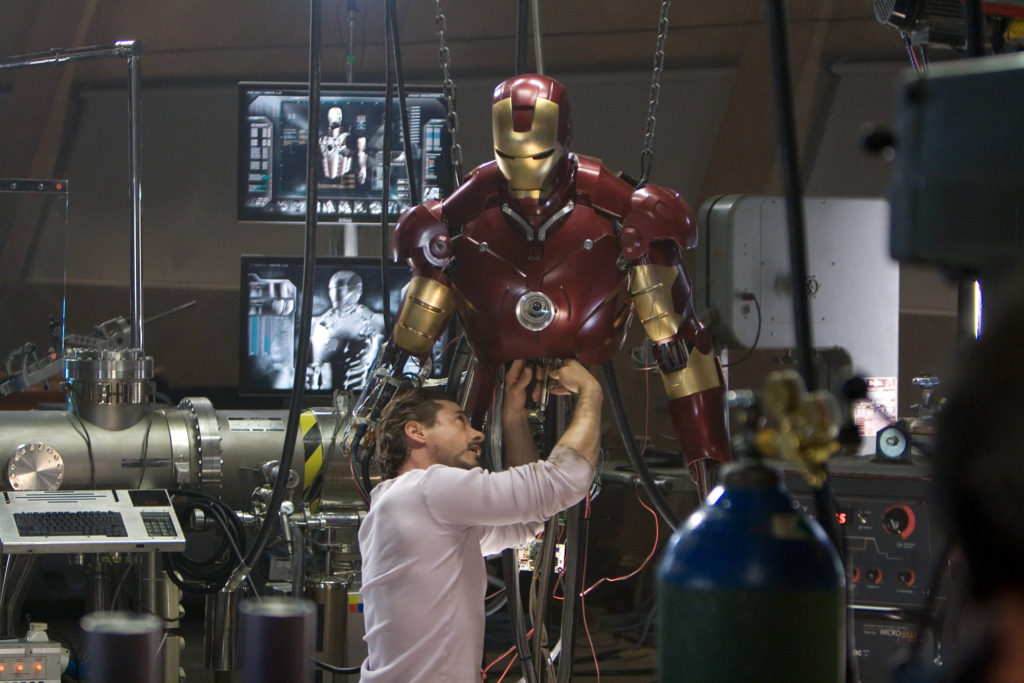 The MCU's Tony Stark works on an Iron Man suit in his high tech laboratory.