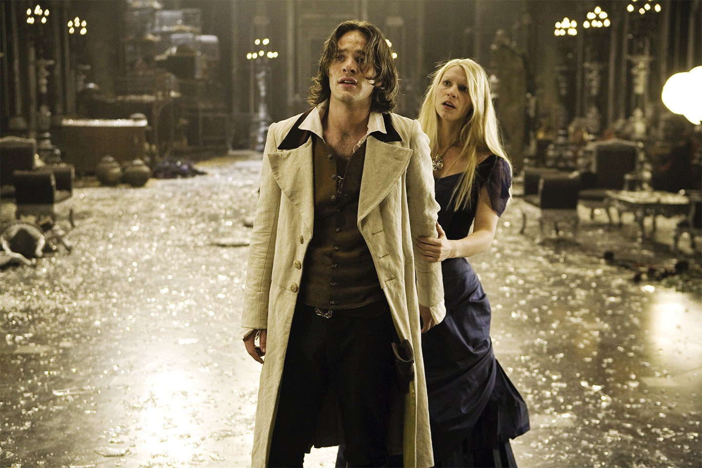 At the end of Stardust, Tristan (played by Charlie Cox) is standing in front of Yvaine (played by Claire Danes) as they both look at something in fear. There is shattered glass all over the ground.