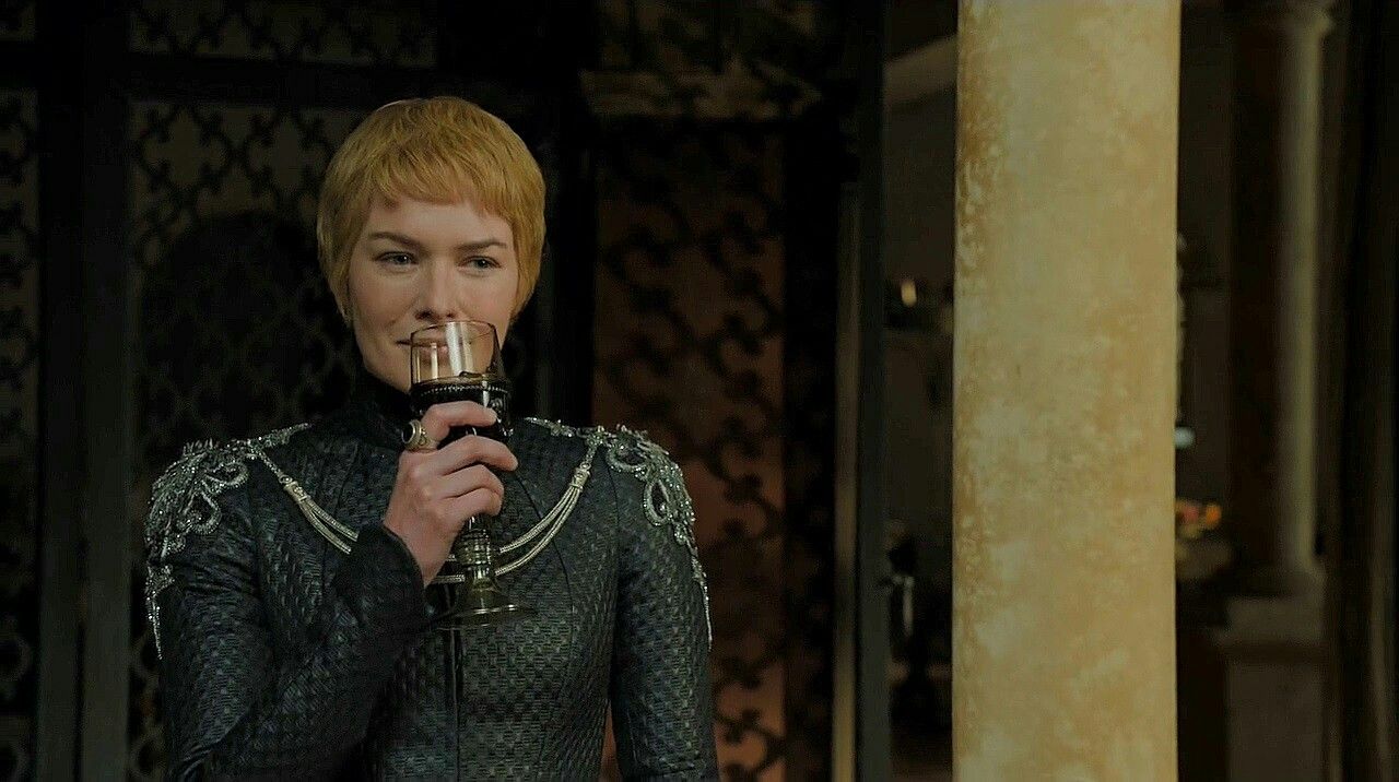 Cersei enjoys some wine as she watches the explosion.