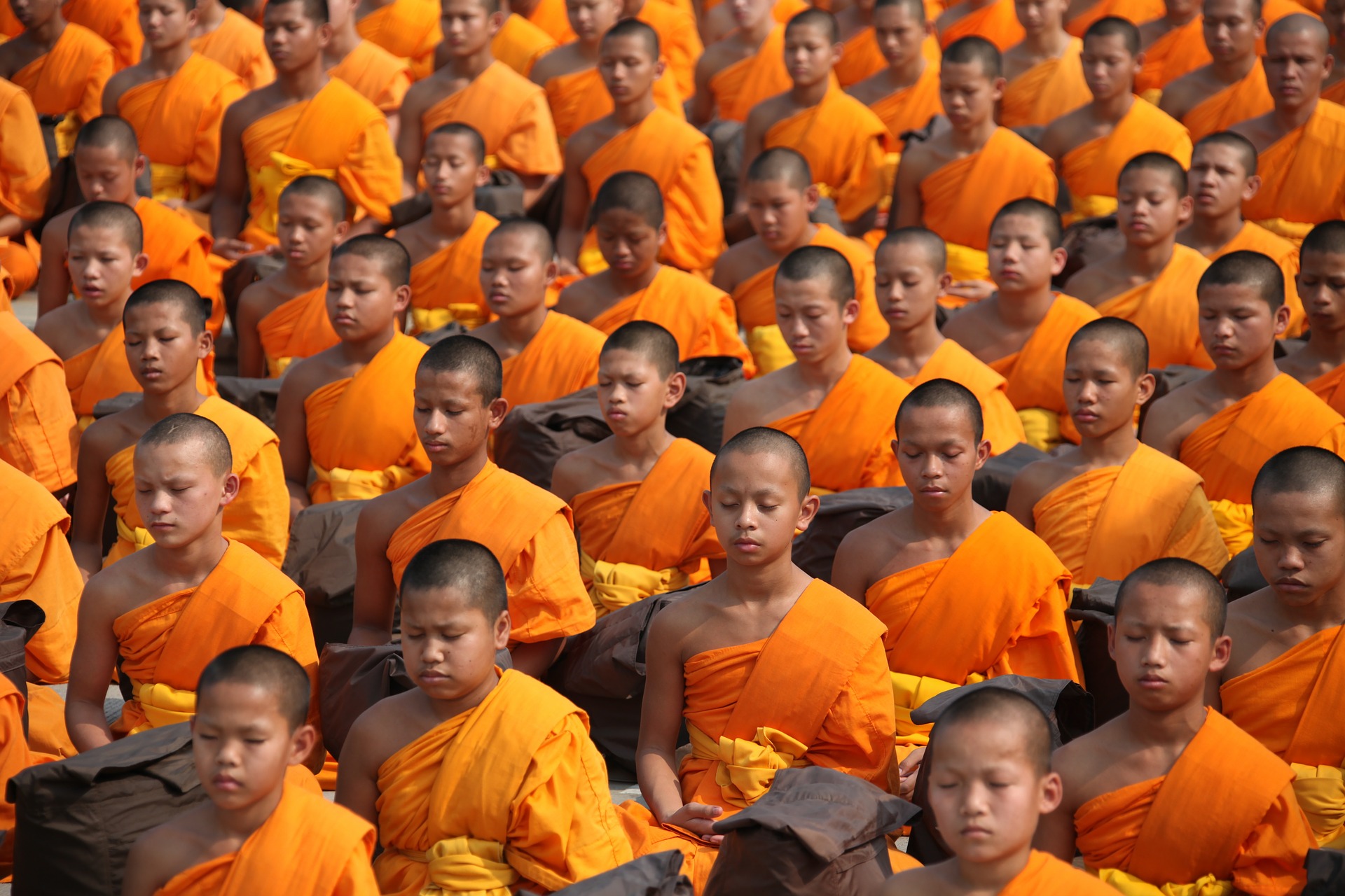 Young Buddhists meditating.