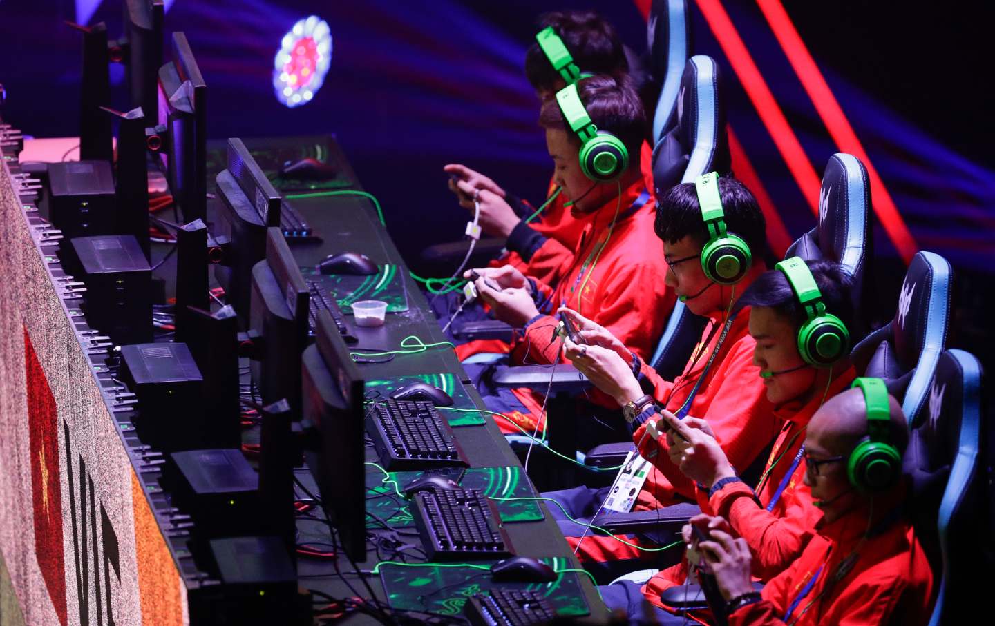 Players concentrate on the game during an esports competition in the Philippines