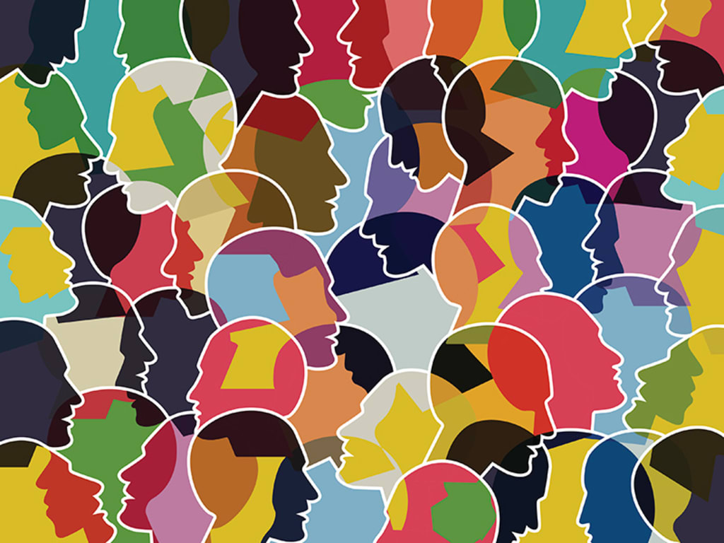 Image of multiple faces of different colors representing the breakdown of cultural identity.