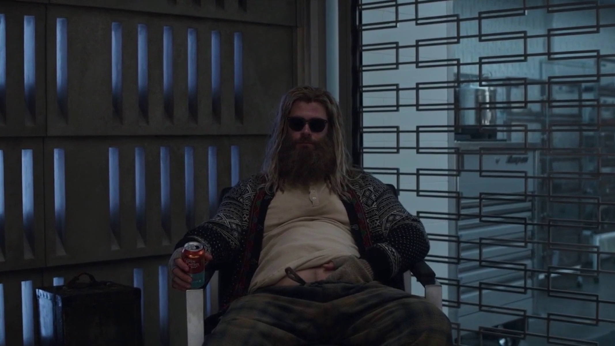 This shot is from Avengers: Endgame (2019) when a newly heavy Thor spoke to Rocket Raccoon and The Hulk, with long hair and a beer in his hand. 