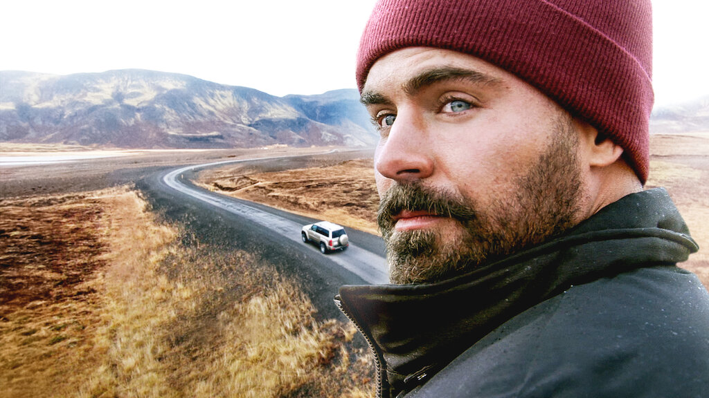 Zac pictured in the foreground of an image of Iceland