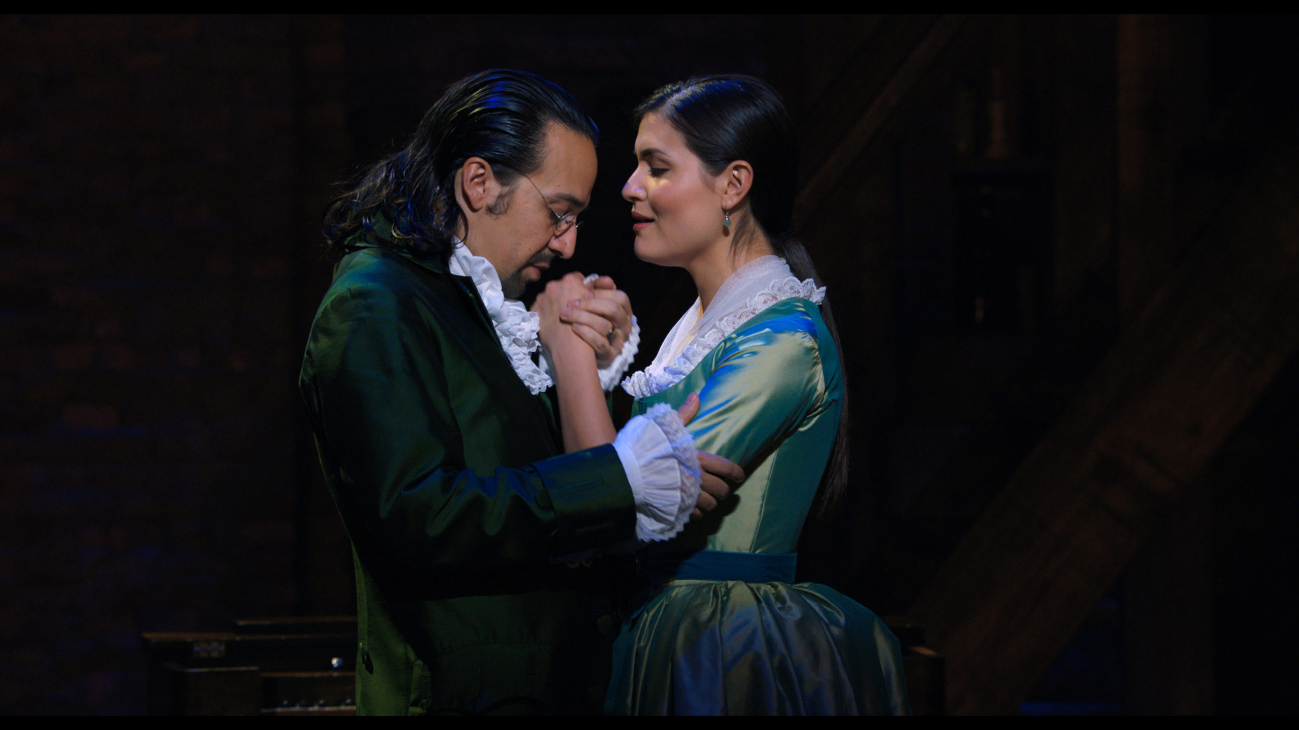 Hamilton embraces his wife, Eliza, as he asks her to marry him.