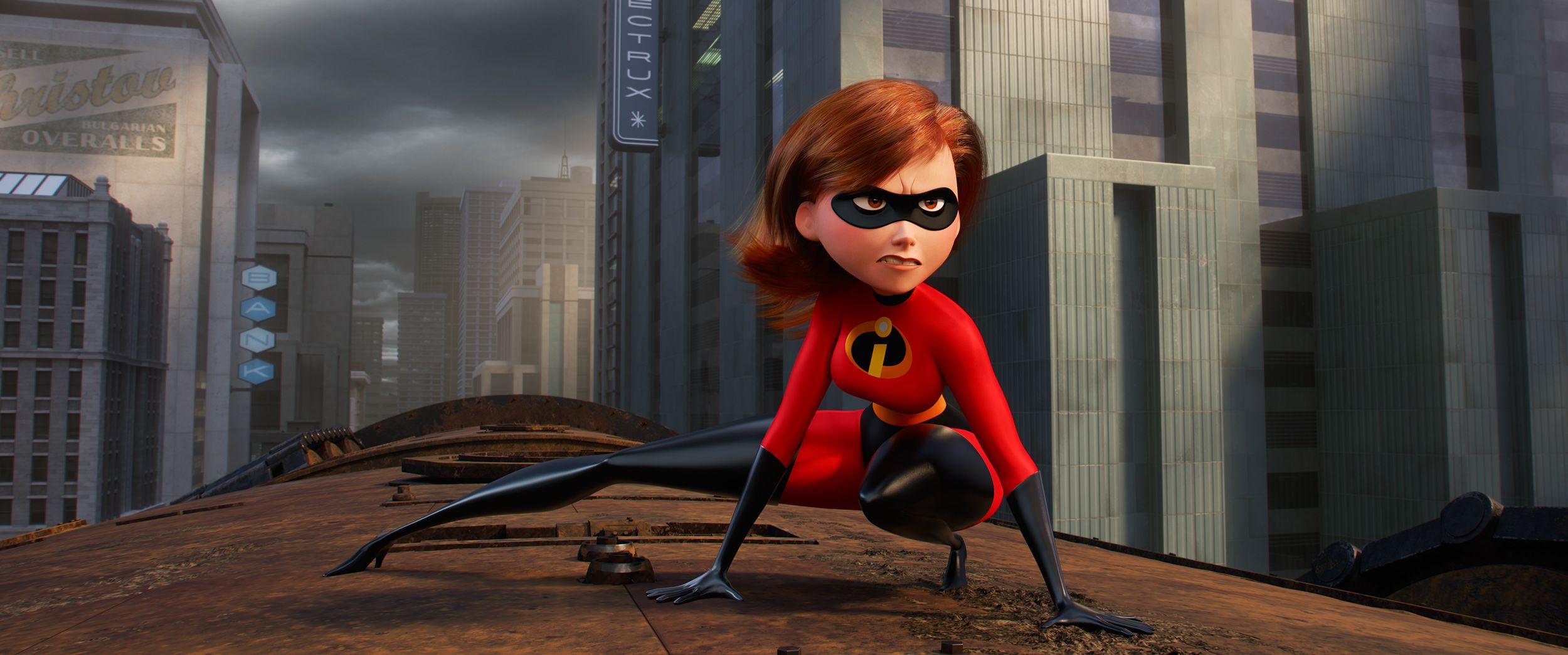 Elastigirl crouches on top of a rogue train in The Incredibles 2.